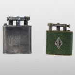 A Dunhill pocket lighter, inscribed JET to the front, in a shagreen cover,