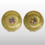 A pair of Royal Worcester porcelain cabinet plates, painted with fruit, each signed Freeman,