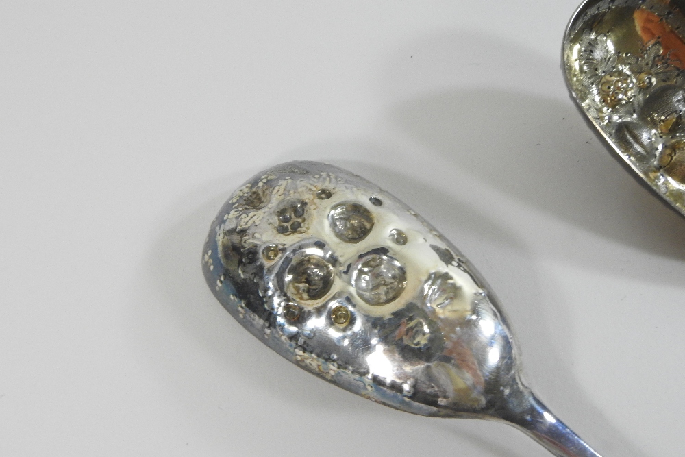 A pair of Victorian silver berry spoons, with engraved decoration and embossed gilt bowls, - Image 9 of 9