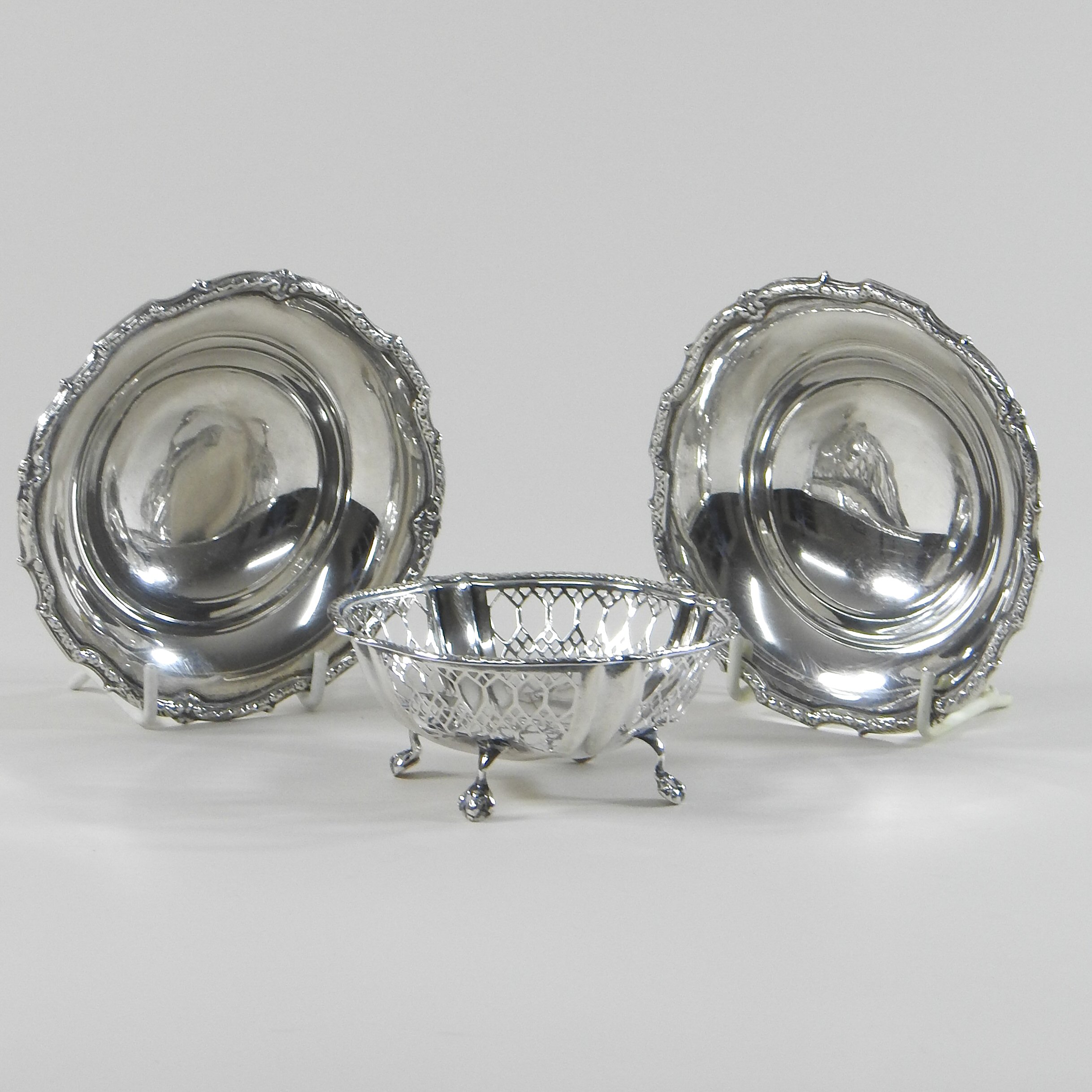 A pair of early 20th century silver bon-bon dishes, with scrolled borders, Birmingham 1938,