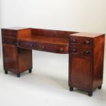 A William IV mahogany pedestal sideboard, with a central drawer, flanked by a pair of cupboards,