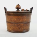 A 19th century treen burr yew butter churn, of tapered form, with a removable lid,