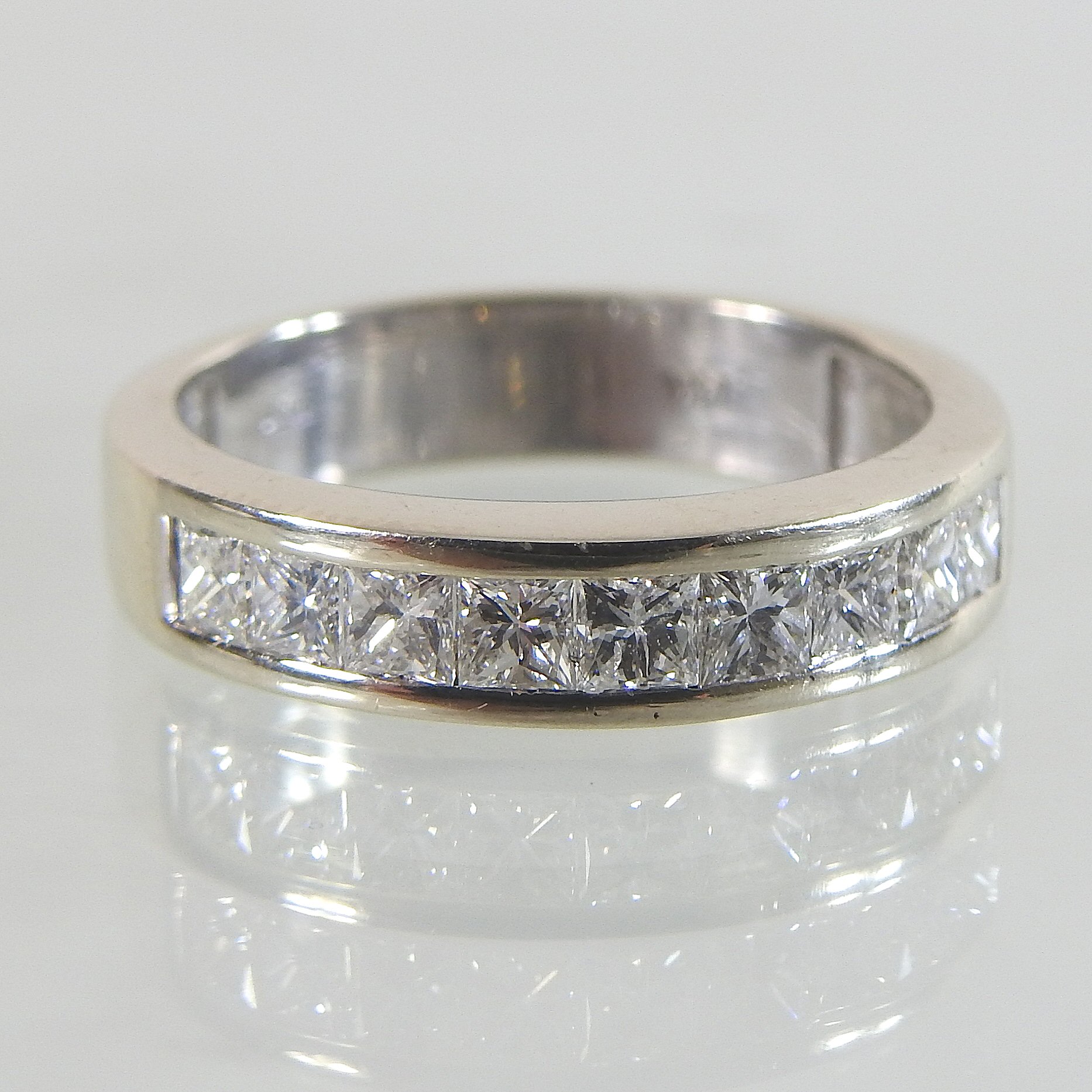 A 14 carat gold diamond ring, the single princess cut stone approx 1.