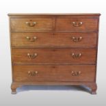A George III mahogany chest, containing two short, over three long graduated drawers,
