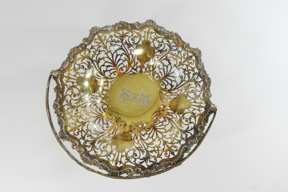 An Edwardian silver gilt cake basket, of pierced scalloped shape, with a swing handle, - Image 6 of 6