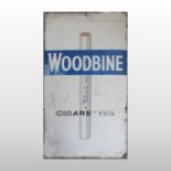 A vintage enamel advertising sign, 'Woodbine cigarettes',