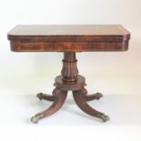 A Regency rosewood, crossbanded and brass strung D shaped folding card table, with a hinged top,