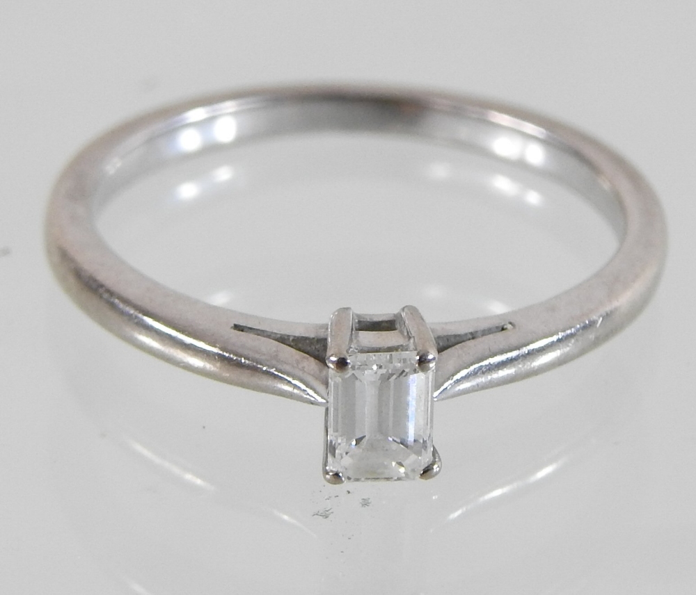 An 18 carat gold solitaire diamond ring, set with a single baguette cut stone, approximately 0. - Image 3 of 4