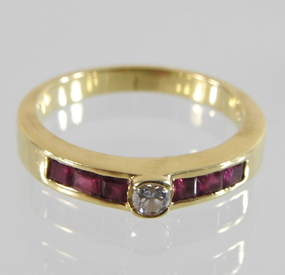 An 18 carat gold diamond ring, with channel set ruby shoulders, - Image 2 of 4