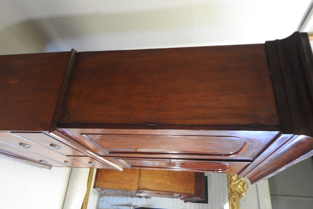 A 19th century mahogany linen press, fitted with slides, standing on a plinth base, - Image 10 of 12