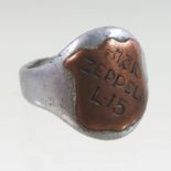 A World War I aluminium and copper signet ring, inscribed 31/316 Zeppelin L.15.
