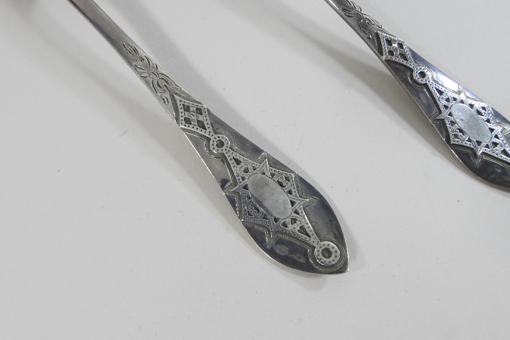 A pair of Victorian silver berry spoons, with engraved decoration and embossed gilt bowls, - Image 5 of 9