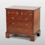 A William and Mary style oyster veneered and feather banded bachelor's chest,