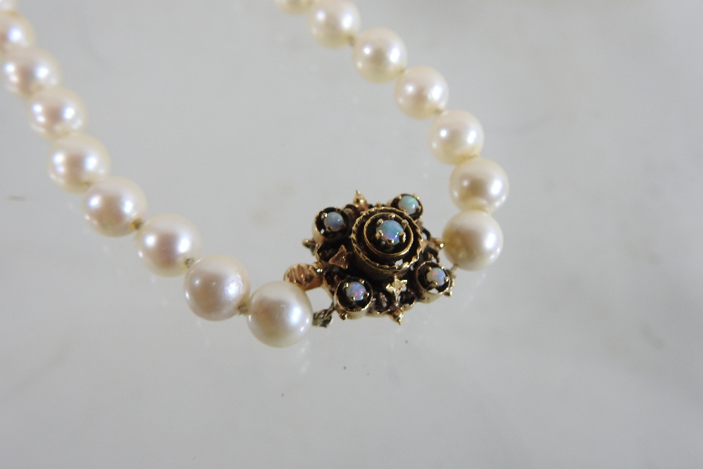A 14 carat gold opal and diamond cluster ring, together with a cultured pearl single stand necklace, - Image 7 of 8