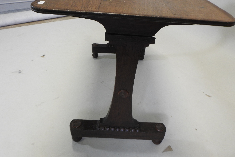 A Regency grained oak side table, with a rectangular top, on scrolled end supports, - Image 2 of 4