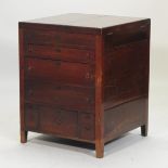 A George III mahogany enclosed washstand, with a dual hinged top and cupboards below,