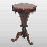 A Victorian rosewood trumpet work table, standing on a tripod base,