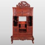 A Chinese red lacquered cabinet,