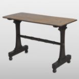 A Regency grained oak side table, with a rectangular top, on scrolled end supports,