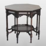 An Edwardian mahogany octagonal occasional table, the frieze with fret carved decoration,