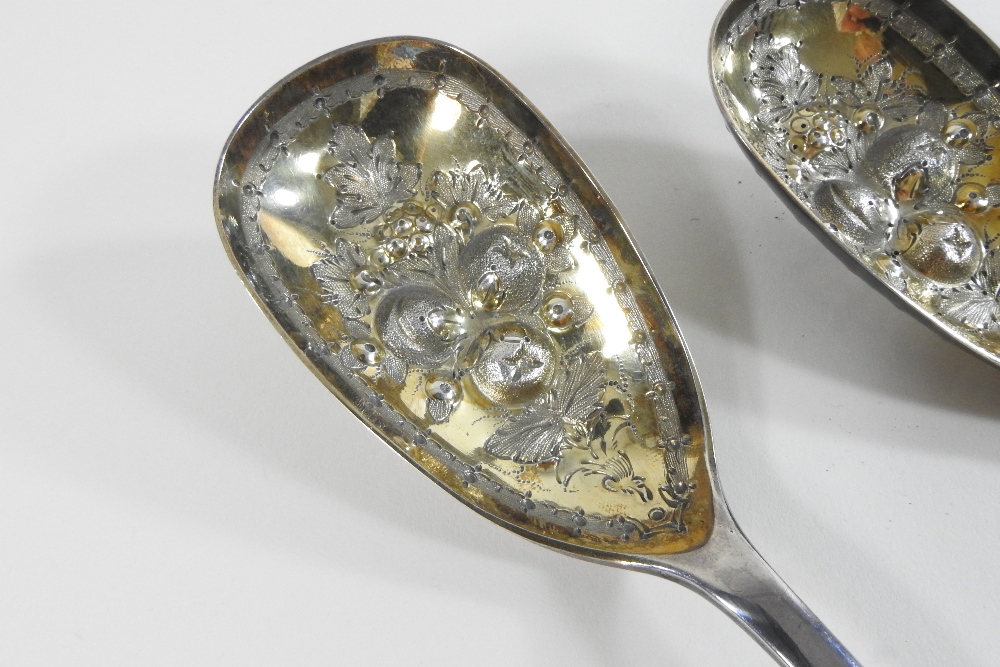 A pair of Victorian silver berry spoons, with engraved decoration and embossed gilt bowls, - Image 6 of 9