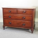 A Victorian mahogany chest of drawers, on turned feet,