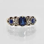 A 15 carat gold sapphire and diamond five stone ring,