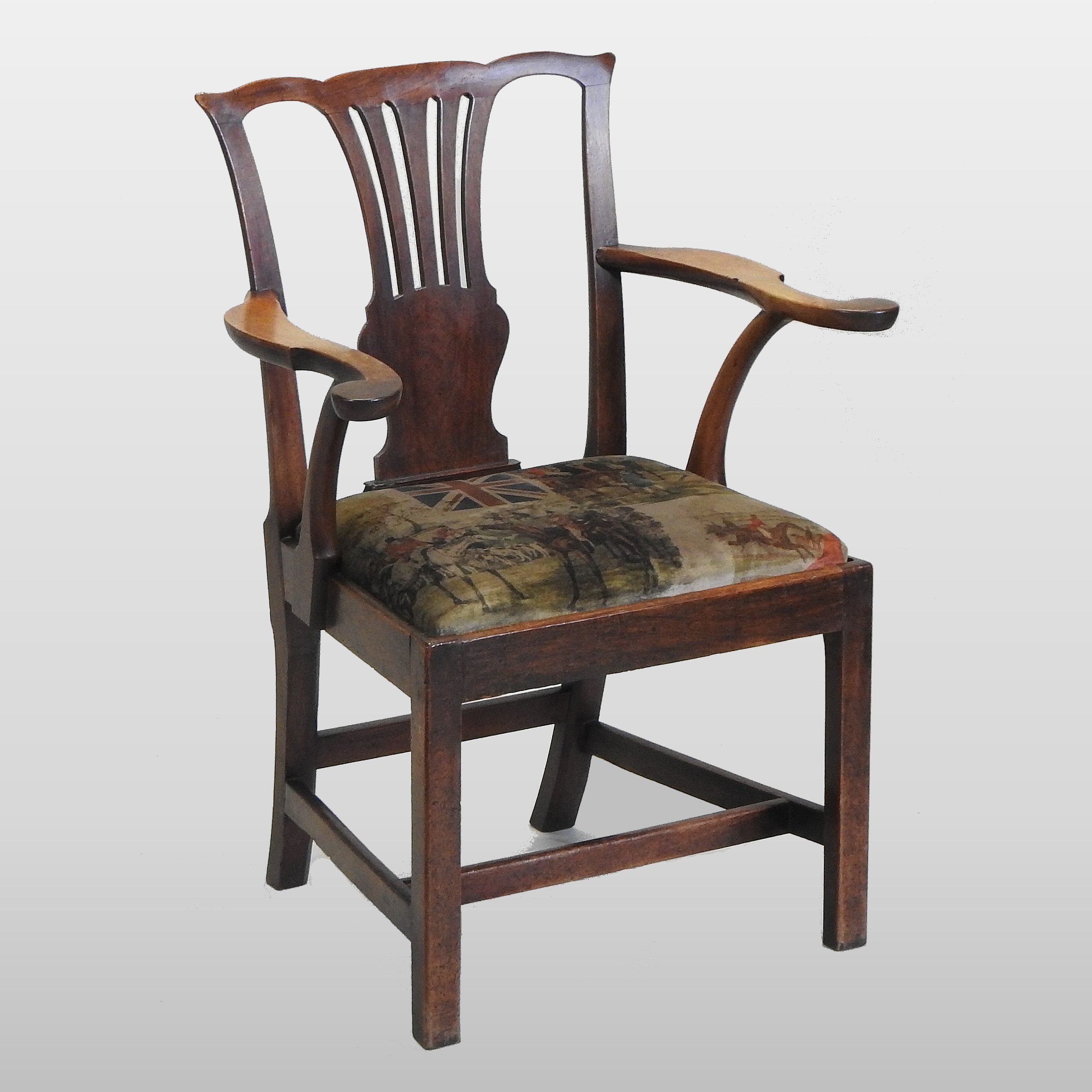 A George III fruitwood elbow chair,