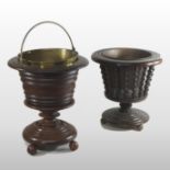 A 19th century oak peat bucket, with a brass liner, standing on three ball feet, 45cm high,