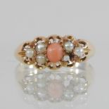 A 15 carat gold coral and seed pearl ring