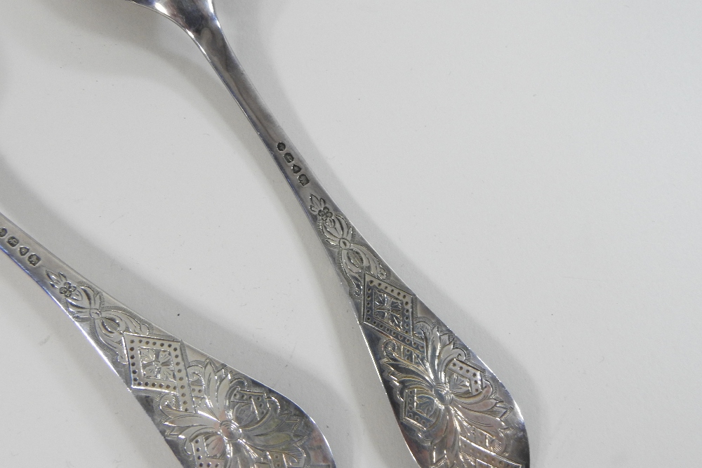 A pair of Victorian silver berry spoons, with engraved decoration and embossed gilt bowls, - Image 3 of 9
