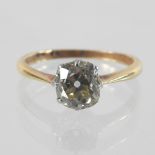 An 18 carat gold and platinum single stone diamond ring, approx 1.