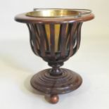 A Dutch mahogany peat bucket, with brass liner, standing on three ball feet,
