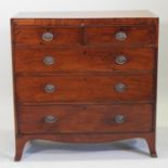 A George III mahogany chest, containing two short over three long drawers, on bracket feet,