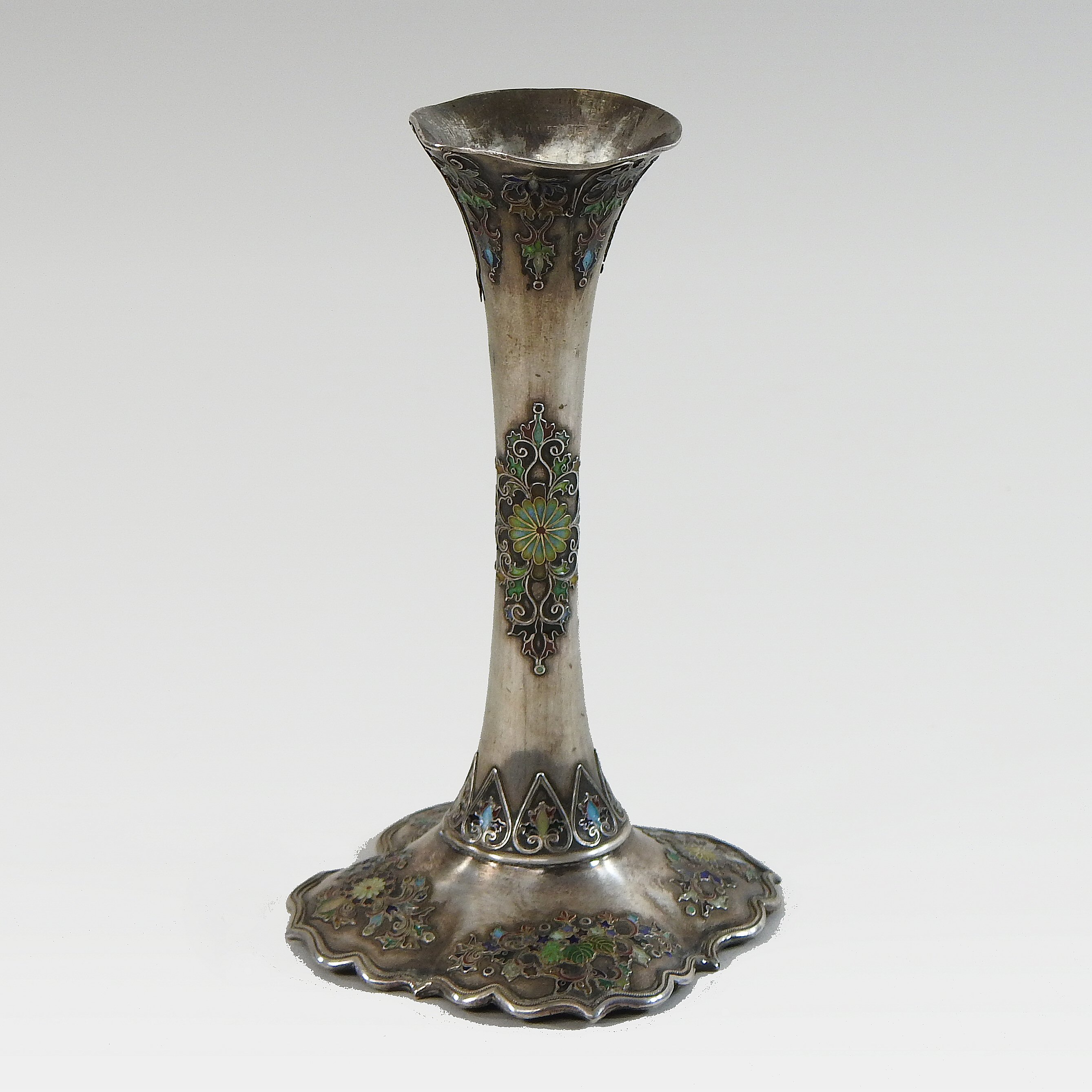 An early 20th century Eastern silver and enamelled vase, of tapered shape,