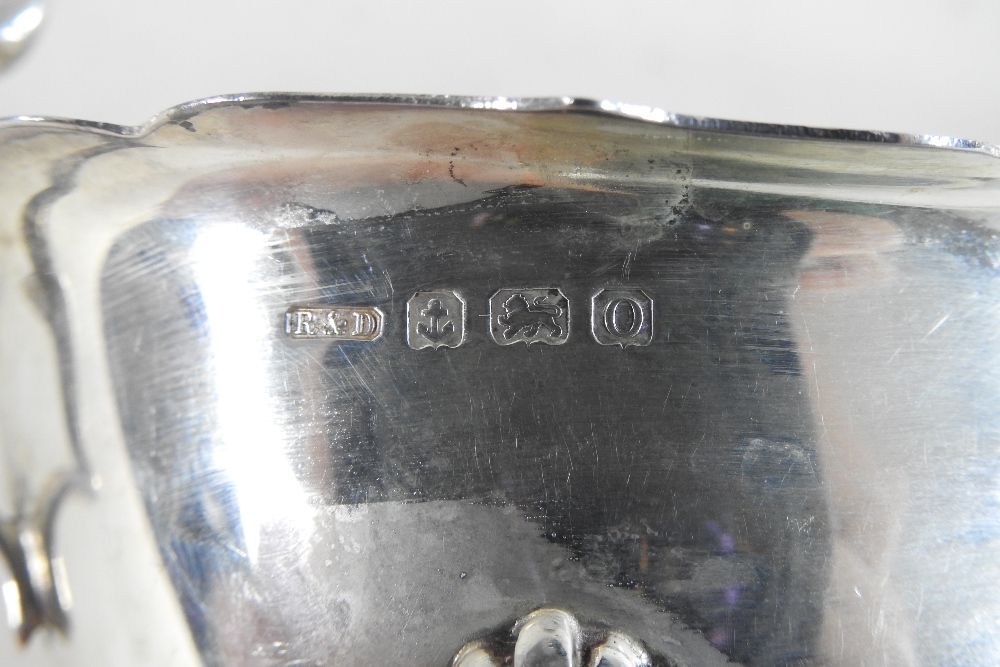 An early 20th century silver sauce boat, of helmet shape, on cabriole legs, Birmingham 1913, - Image 9 of 9
