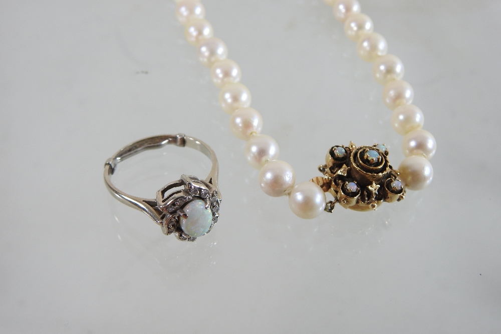 A 14 carat gold opal and diamond cluster ring, together with a cultured pearl single stand necklace, - Image 2 of 8