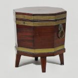 A George III mahogany and brass bound wine cooler, of octagonal shape, with a hinged lid,