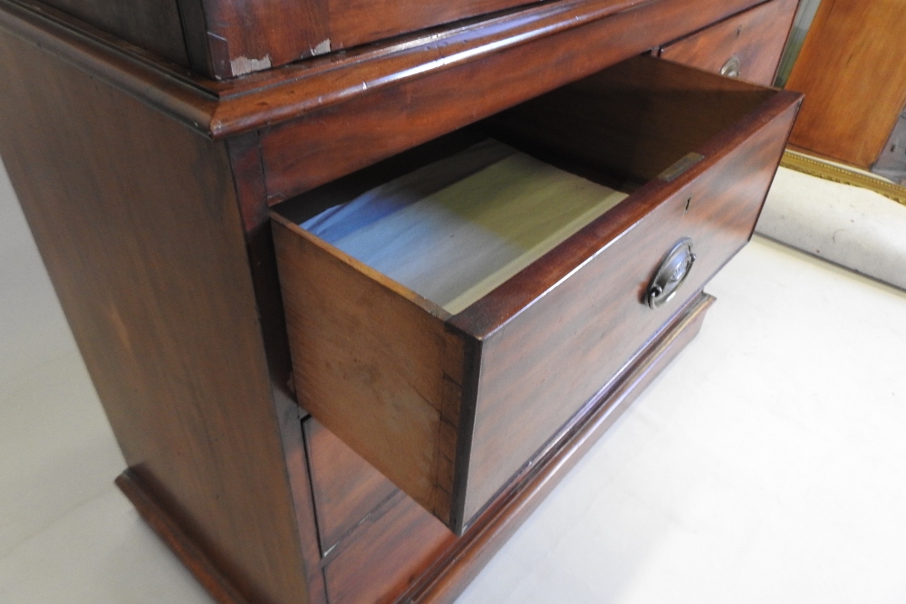 A 19th century mahogany linen press, fitted with slides, standing on a plinth base, - Image 2 of 12