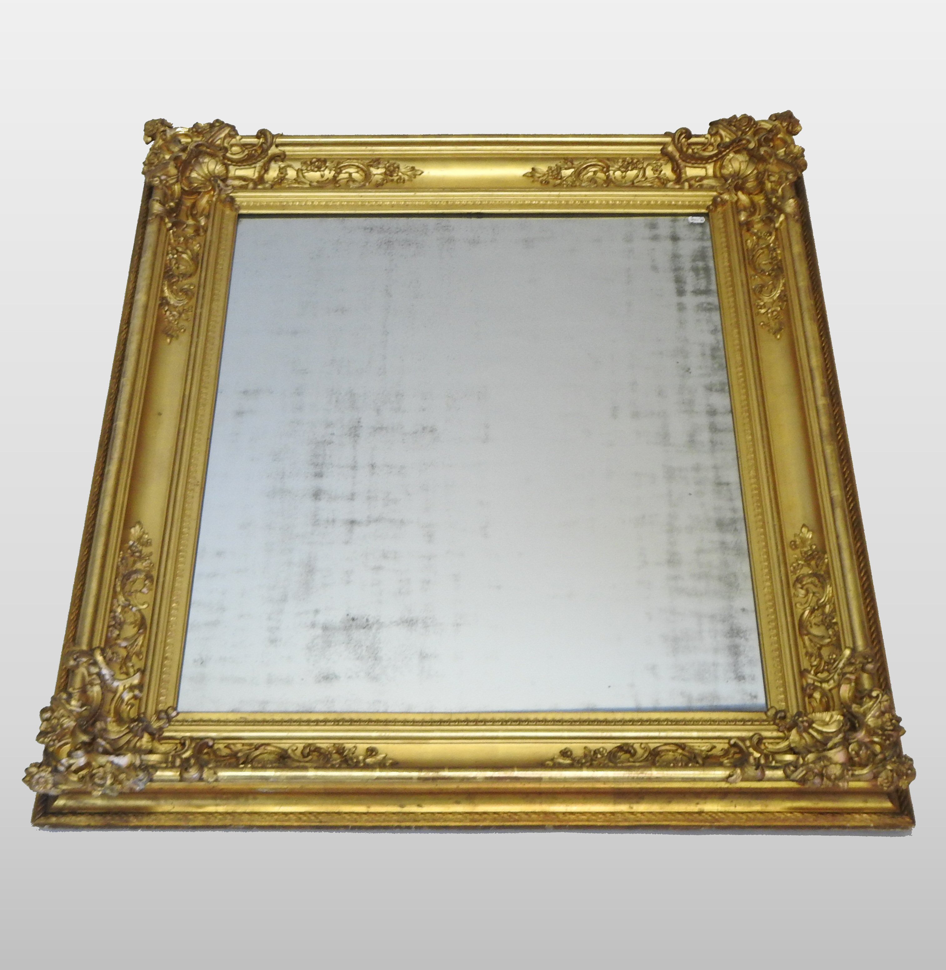 A large 19th century carved wood and gilt gesso framed wall mirror,