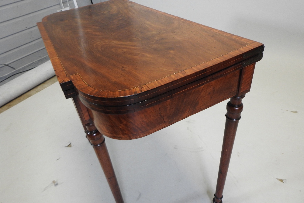A George III mahogany and satinwood crossbanded folding card table, with a hinged breakfront top, - Image 7 of 7