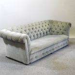 A 1920's green upholstered button back Chesterfield sofa,