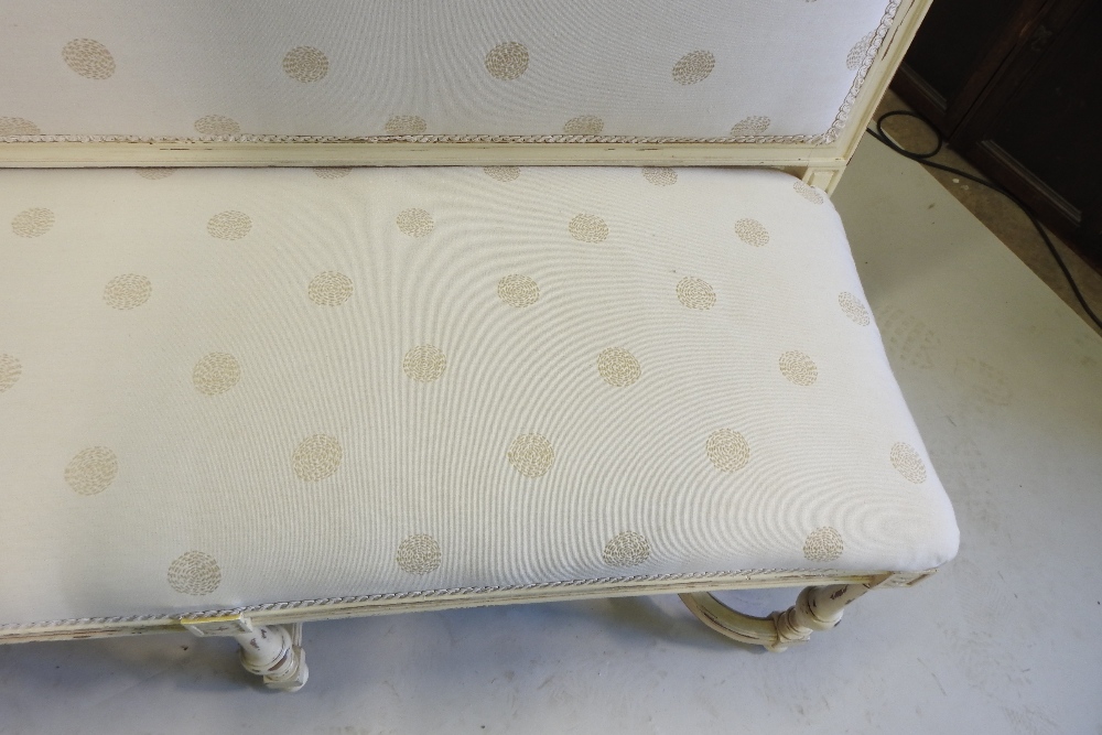 A French style cream upholstered high back sofa, on turned legs, united by shaped stretchers, - Image 8 of 9