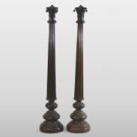 A pair of early 20th century bronze table lamps, each of slender reeded form,