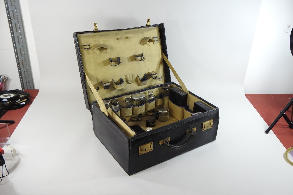 An early 20th century travelling vanity case, inscribed in gold with the initials DHS to the lid, - Image 10 of 17