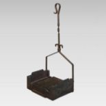 An antique cast iron boot scraper, with a wrought iron handle,