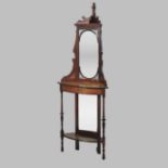 An Edwardian inlaid rosewood corner whatnot, with a mirrored back and turned supports,