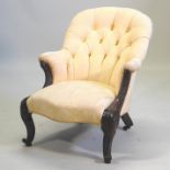 A Victorian carved mahogany and cream upholstered button back armchair,