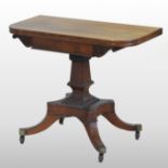 A Regency rosewood folding tea table, the hinged D shaped top,