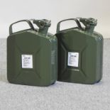 A pair of green painted metal 5 litre jerry cans